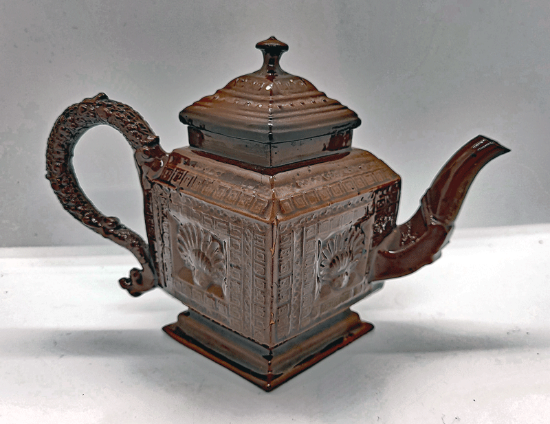 A Red Stoneware Lozenge Shaped Teapot