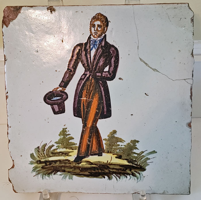 Ceramics<br>19th Century<br>Large tin-glazed tile with a dandy