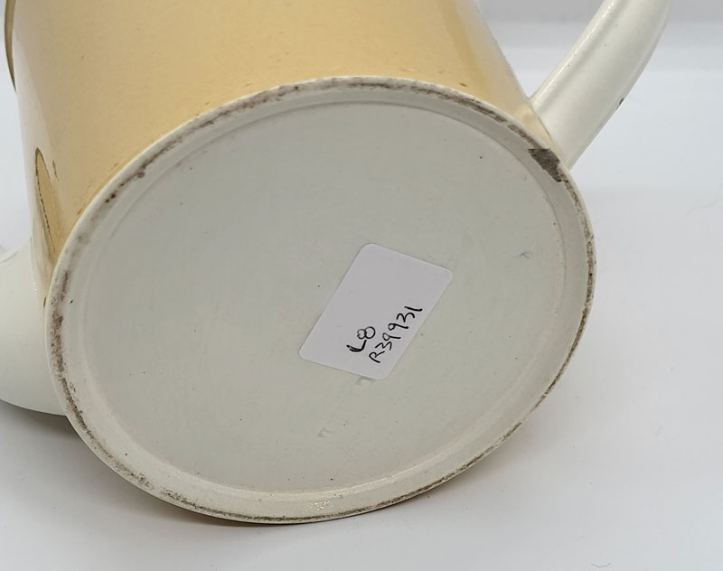 Creamware teapot with slip decoration