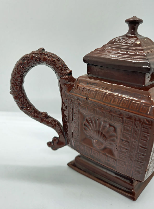 Just In<br>A Red Stoneware Lozenge Shaped Teapot