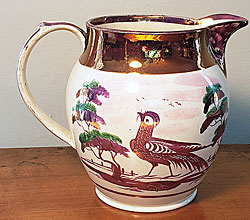 Pink lustre jug with bird