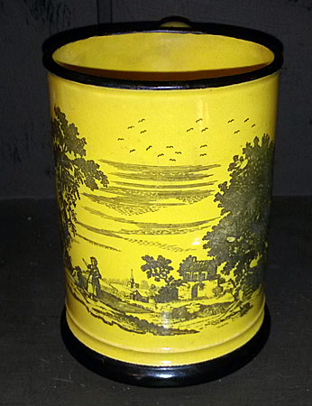 Yellow-glazed mug with black transfer