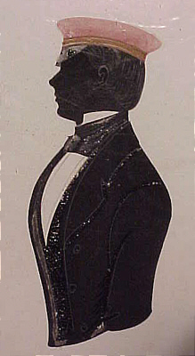 SOLD   Silhouette of a young man in a red cap.