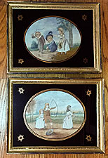 Pair of silk needlework pictures of children playing