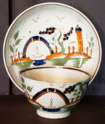 Polychrome Pearlware tea bowl and saucer